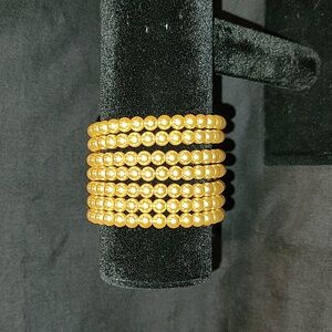 Goldtone stretch Multi- Strand Faux pearl bracelet